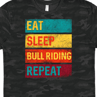 Inktastični bik Riž rodeo jede majicu za vožnju bika za spavanje